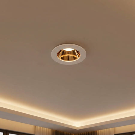 white and gold downlight ceiling light mounted in a modern home ceiling