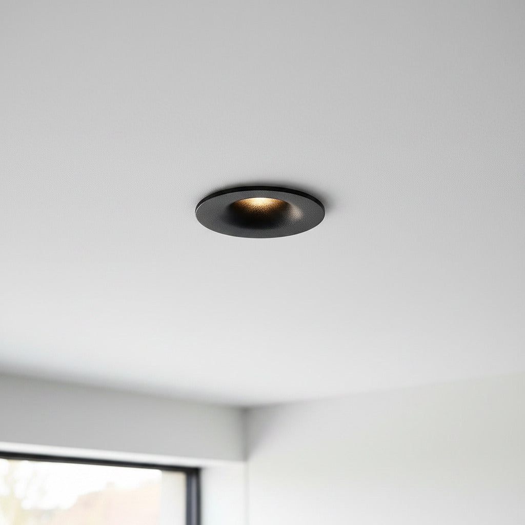 black LED ceiling recessed light installed on the ceiling of a modern home 