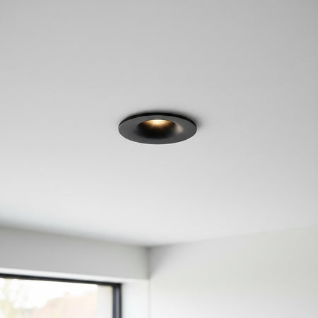 black LED ceiling recessed light installed on the ceiling of a modern home 