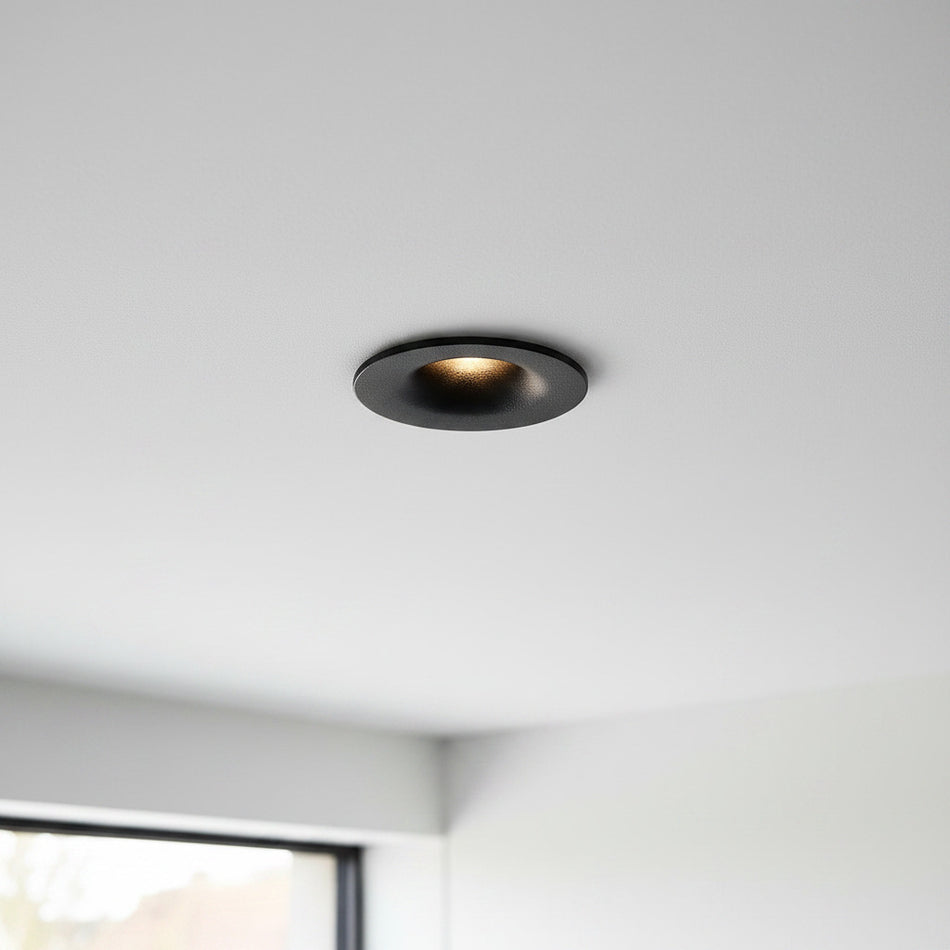 black LED ceiling recessed light installed on the ceiling of a modern home 