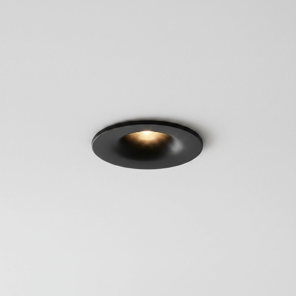 black LED ceiling recessed light mounted in a grey ceiling 
