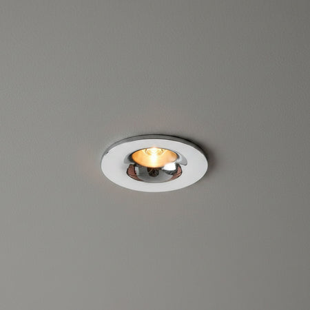 chrome flush recessed downlight mounted in a grey ceiling 