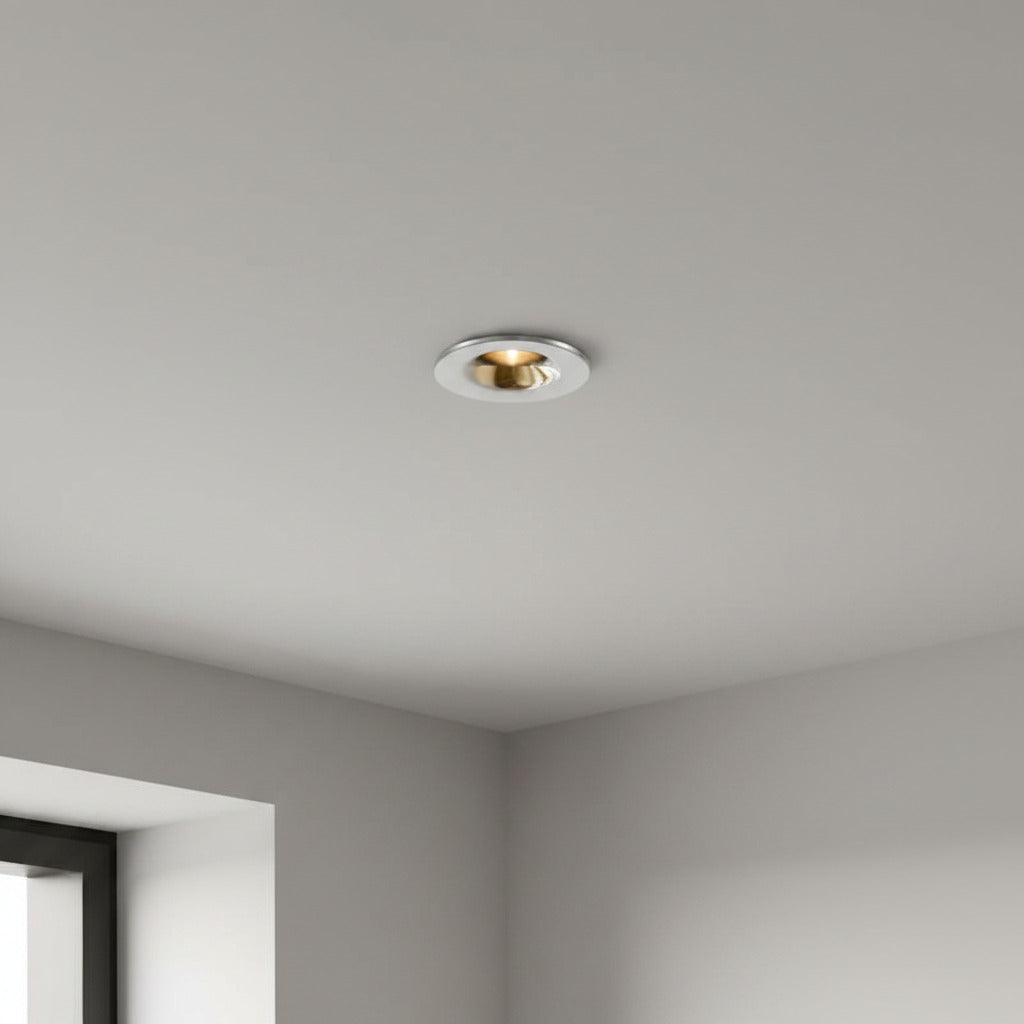 chrome flush recessed downlight installed in a modern home