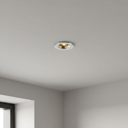 chrome flush recessed downlight installed in a modern home