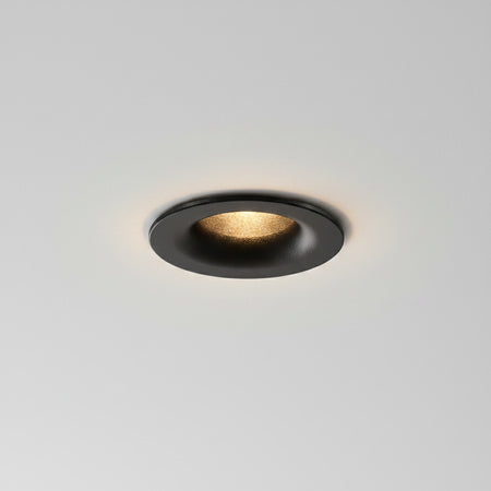 black LED ceiling recessed downlight mounted in the ceiling in a modern home