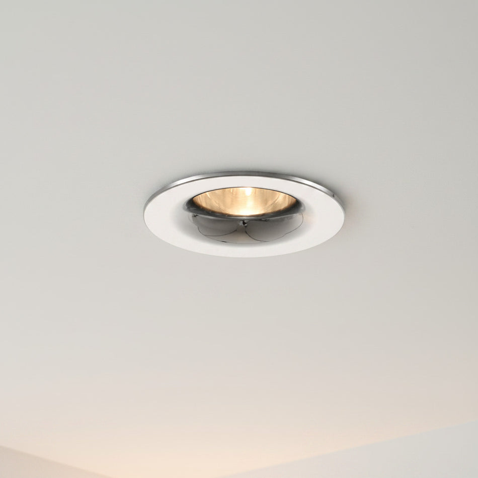 chrome LED recessed spot light installed in a ceiling