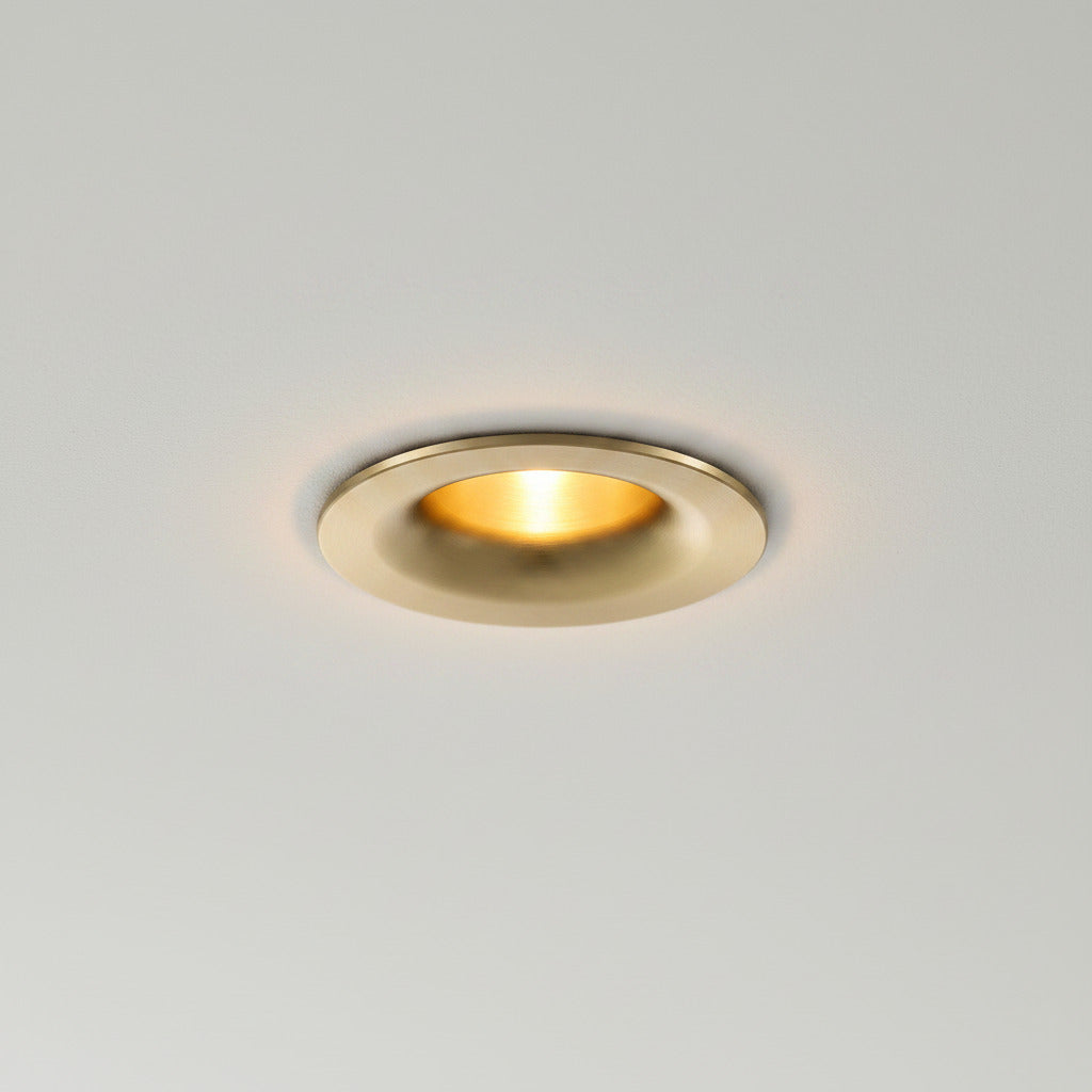 gold LED downlight spotlight installed on a grey ceiling