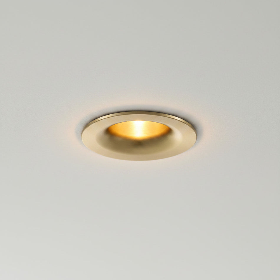 gold LED downlight spotlight installed on a grey ceiling
