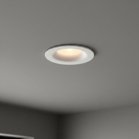 white LED ceiling downlight mounted in a dark grey home ceiling 