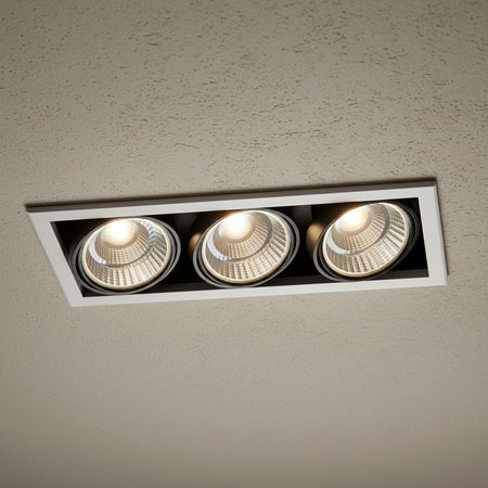 commercial recessed ceiling spotlights installed on a textured hotel ceiling 