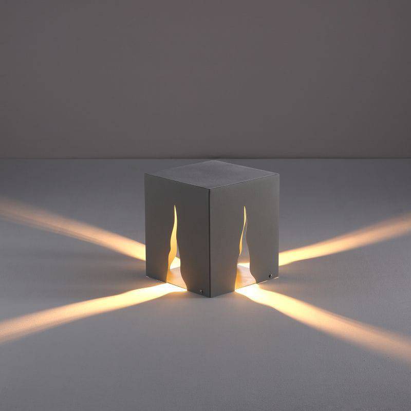 Black contemporary bollard light on a grey background