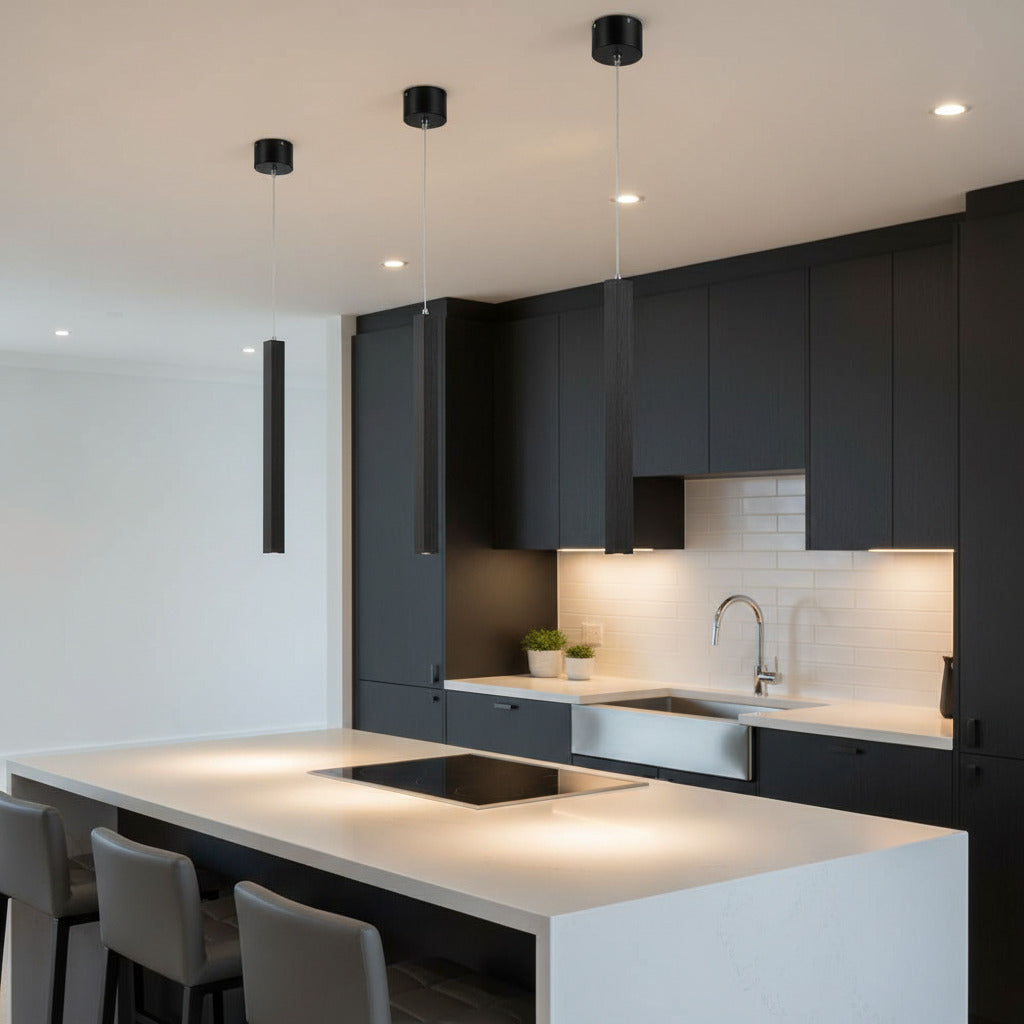 black slimline hanging pendant light mounted over a kitchen island