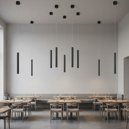 black slimline hanging pendant lighting mounted on a restaurant ceiling
