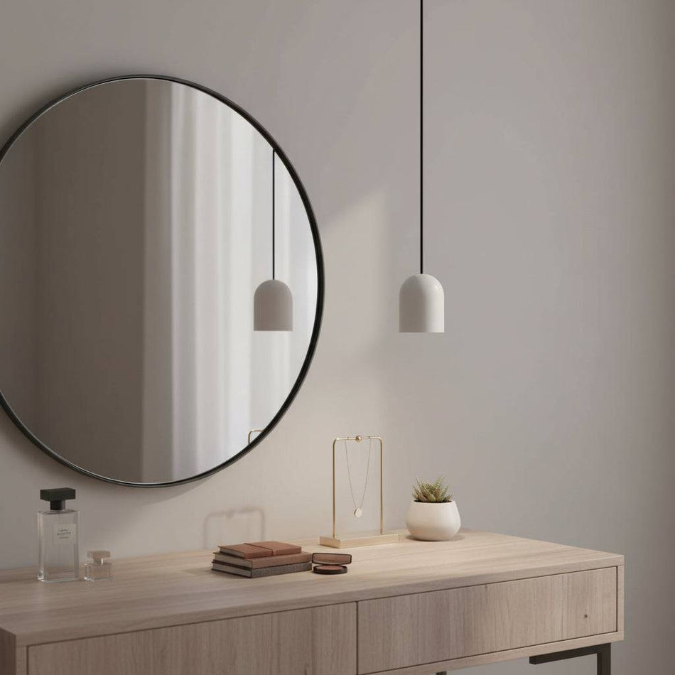 White pendant light above a dressing table  in a modern home