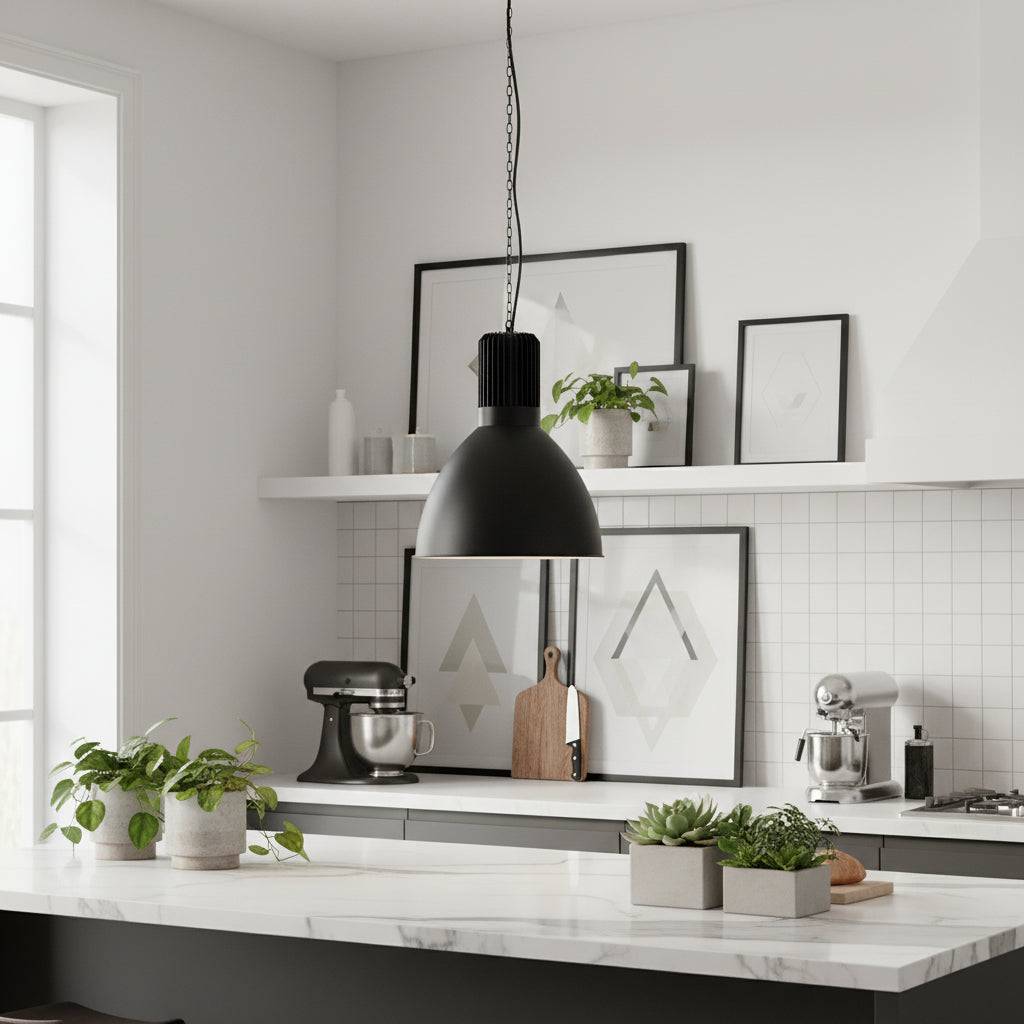 Large pendant light fixture above a  kitchen work top with plants and kitchen utensils