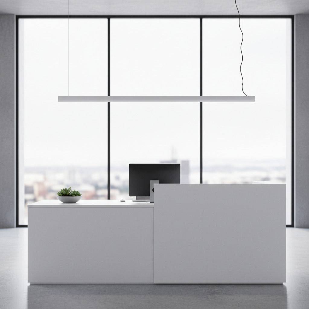 white linear bar pendant light installed over a reception desk 