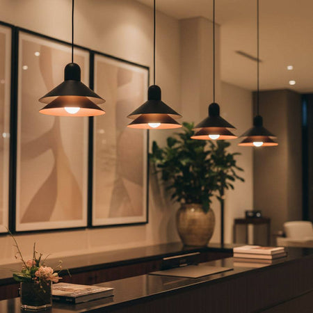 Modern black pendant light above a hotel  reception desk 