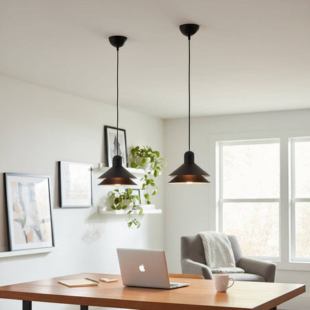 Modern black pendant light above a desk in a study in a modern homme