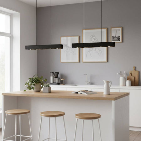 Black hanging pendant ceiling light above a kitchen breakfast bar 