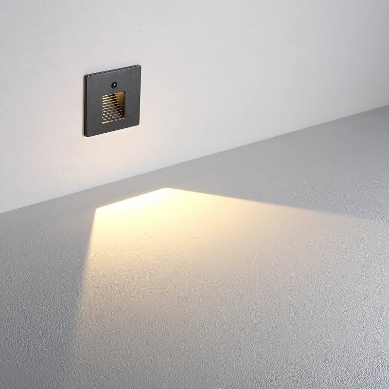 Black motion sensor light for stairs installed on a white wall 