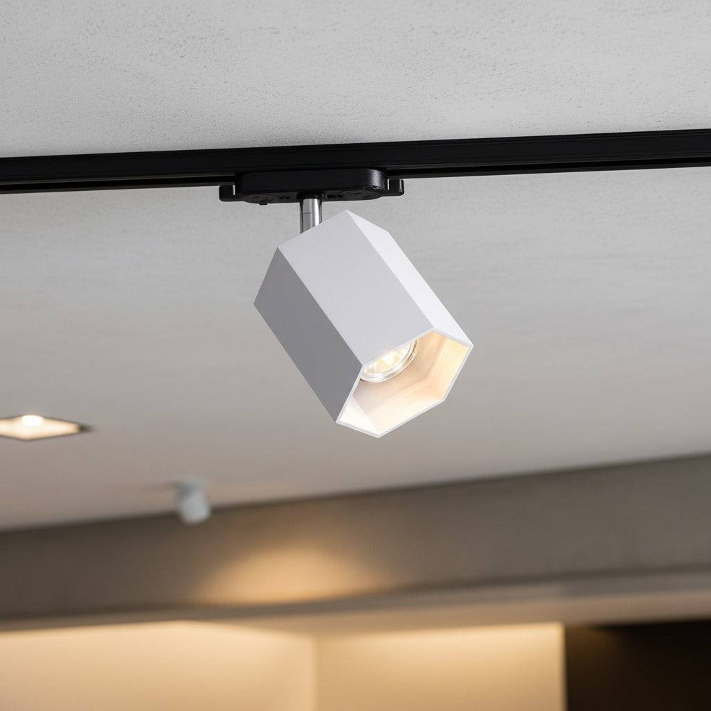 white track light spotlight mounted on the ceiling in a retail store