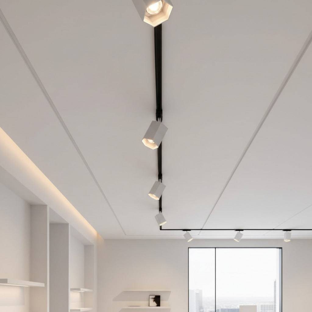white track light spotlight mounted on a white ceiling 