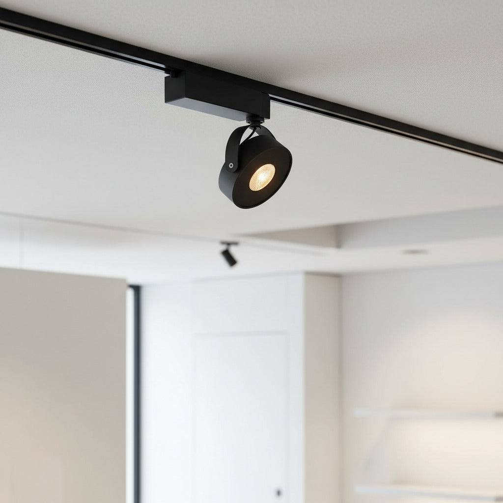 black track lighting fitting mounted on the ceiling in an office