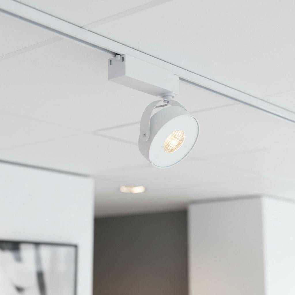 white track lighting fitting mounted on the ceiling in a retail store