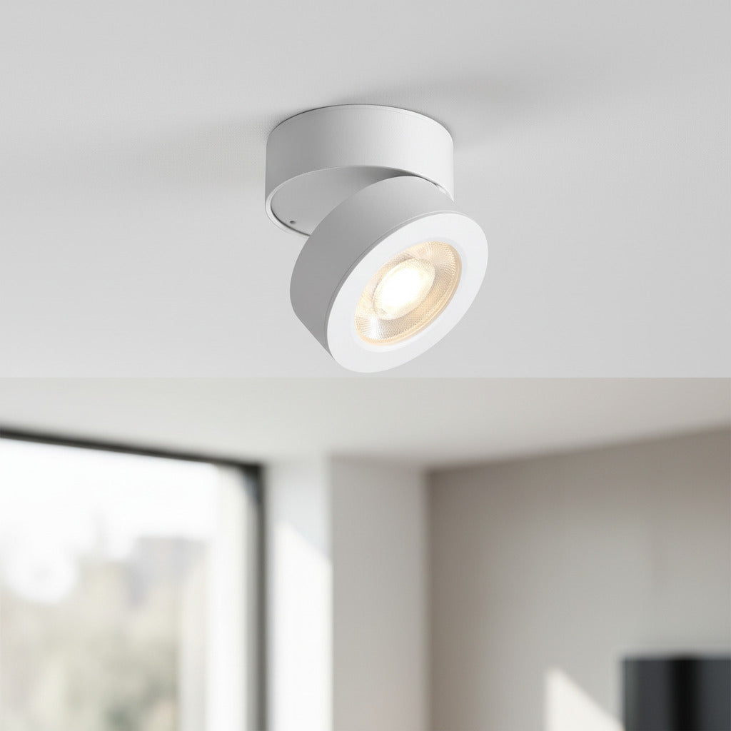 white surface mount adjustable spotlight mounted in a house on a white ceiling