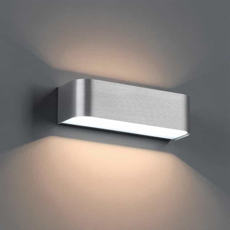 Silver up and down interior wall light on a grey background