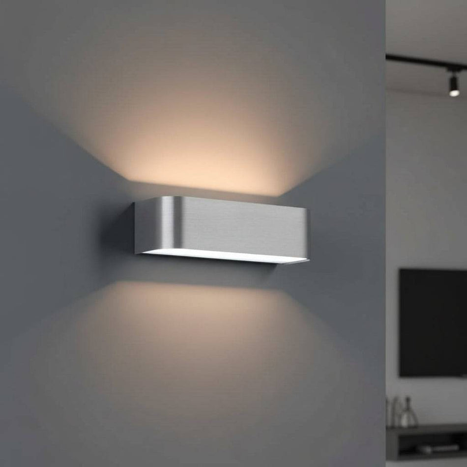 Silver up and down interior wall light  generating soft light in a modern home 