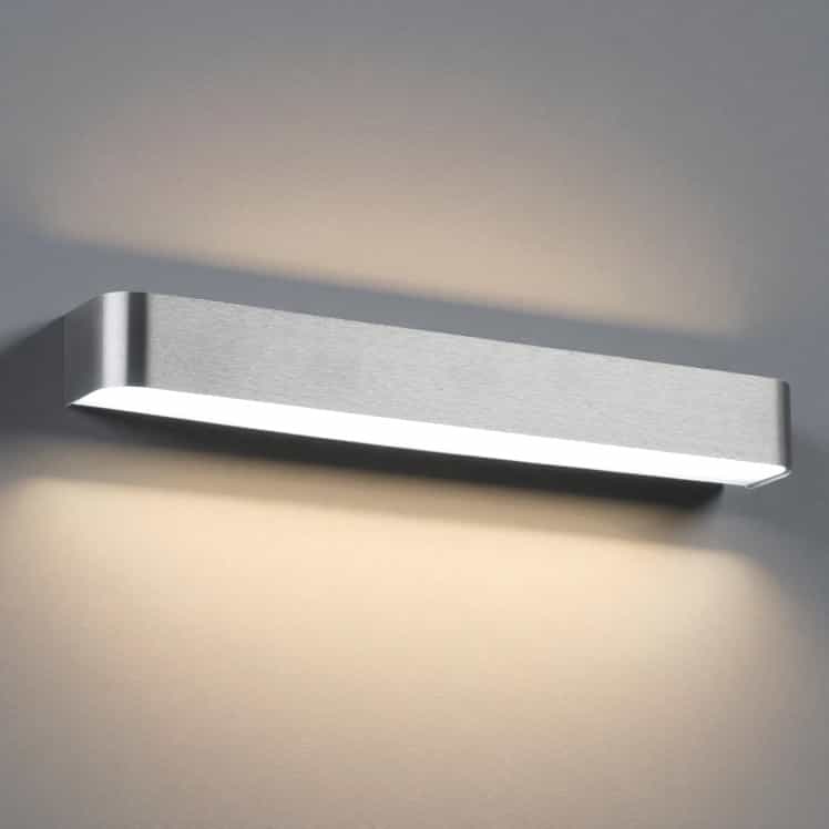 Silver up and down internal wall light on a grey background