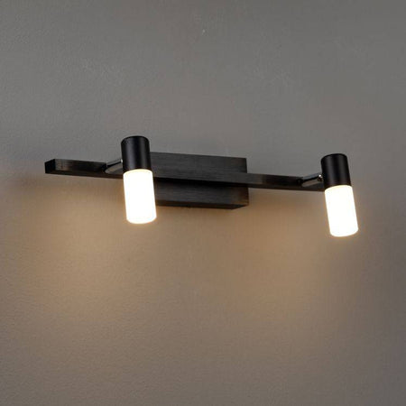 black wall light for bathroom mirror shown mounted on a grey wall 