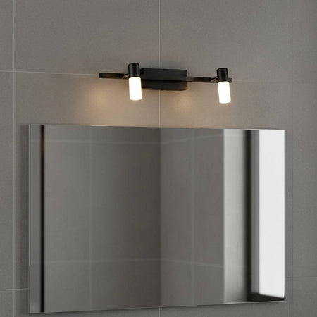 black wall light for bathroom mirror mounted over a mirror in a modern bathroom