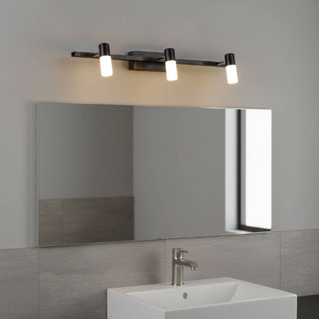 black vanity light over mirror mounted on the wall in a modern bathroom