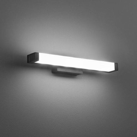 black small bathroom mirror light mounted on a grey wall 