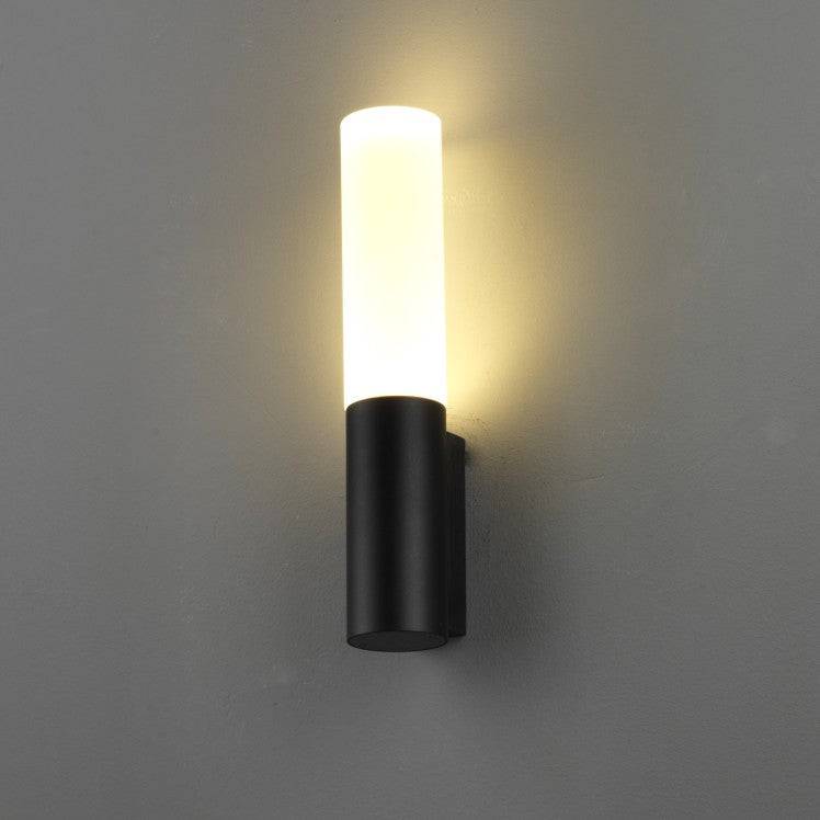 black lantern outdoor light mounted on a white wall 