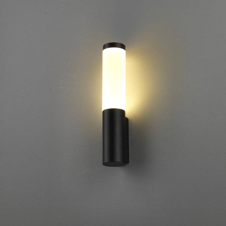 black outdoor wall lantern light installed on a white wall 