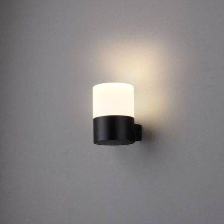 black outside wall mount light shown on a white wall 