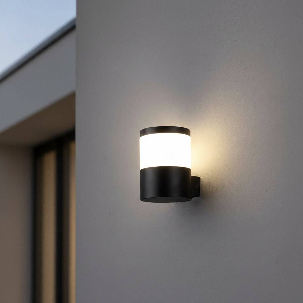 black outside wall lantern mounted on a white wall outside of a modern house
