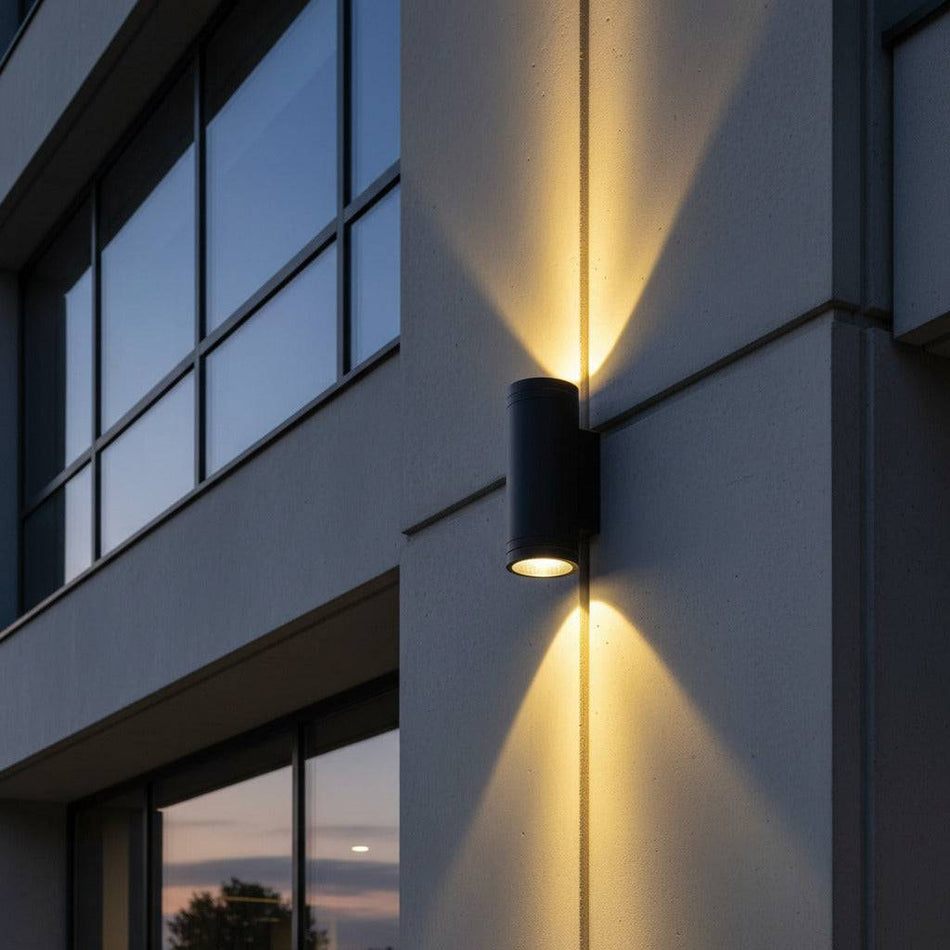black large outdoor wall light mounted on the exterior wall of a commercial building