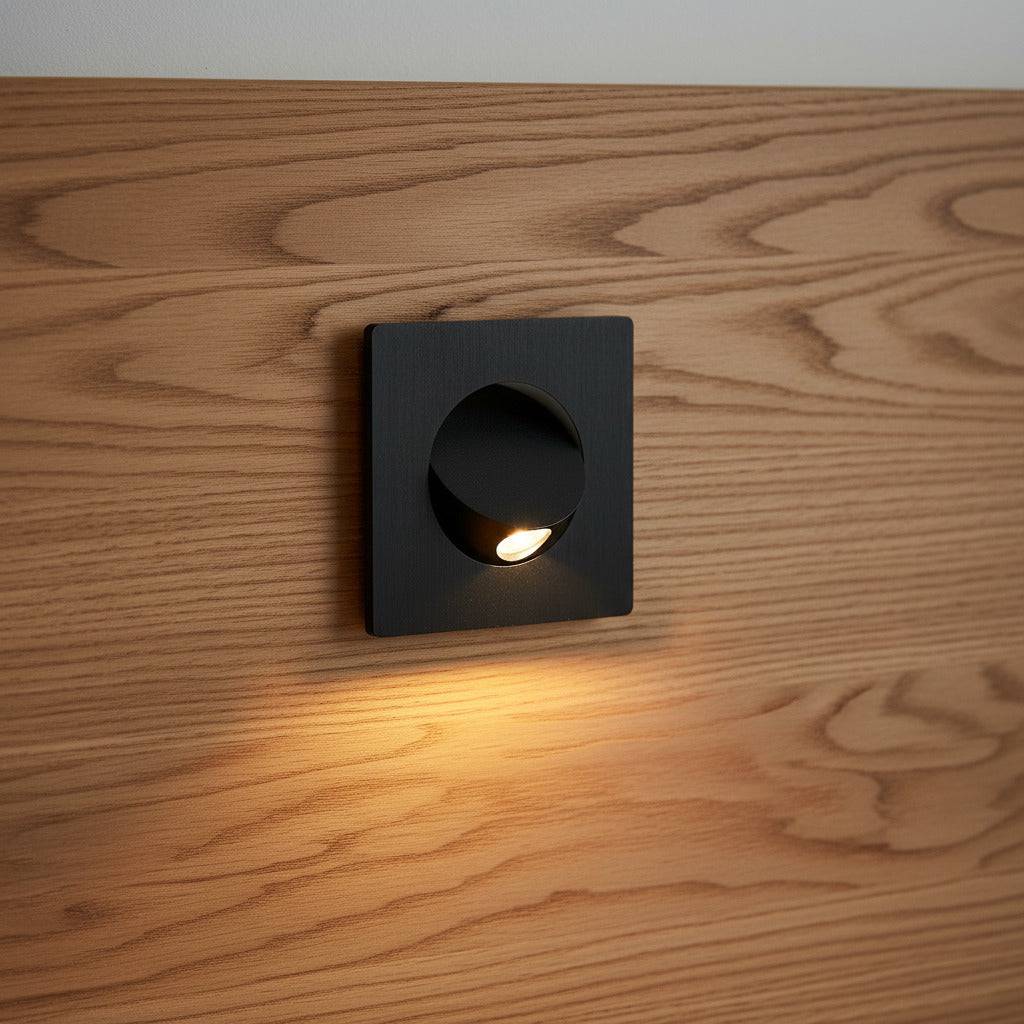 black recessed LED reading lamp for bed recessed into a wooden bed headboard