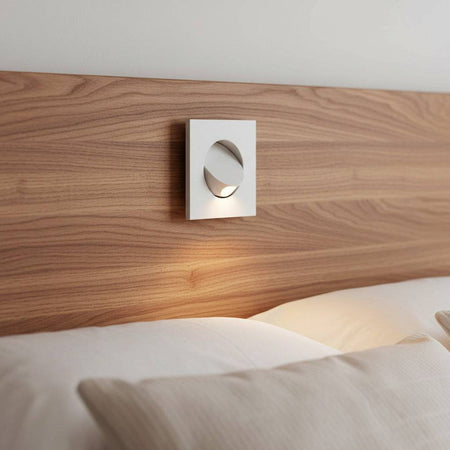 white recessed LED reading light for bed recessed into a wooden bed headboard in a minimailst bedroom
