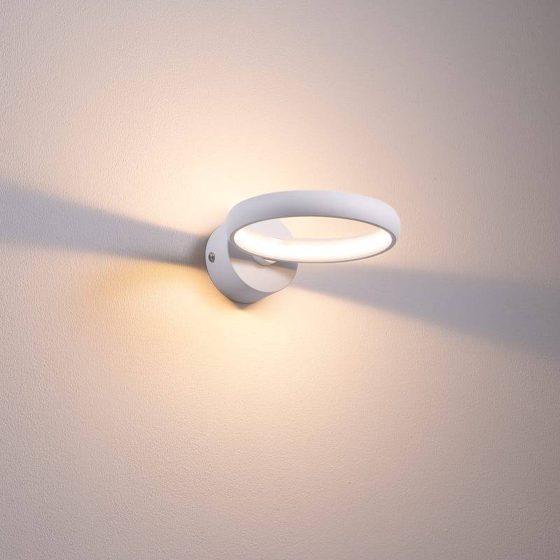 White indoor LED sconce light on a white background