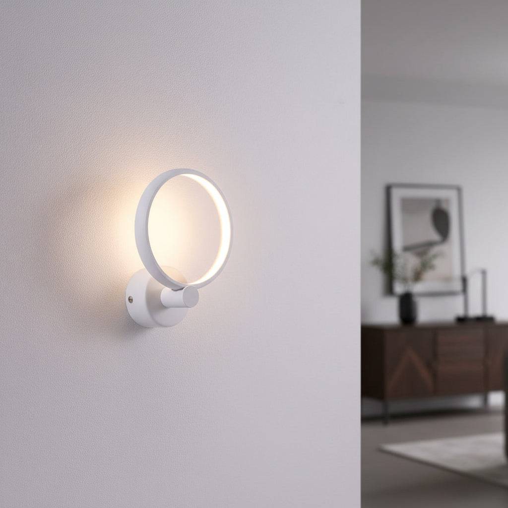 White indoor wall light fixture a round modern light on a grey wall in a modern home
