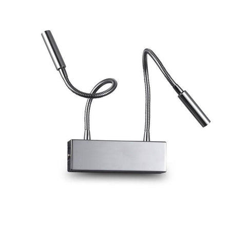 chrome over bed reading light mounted on a white wall