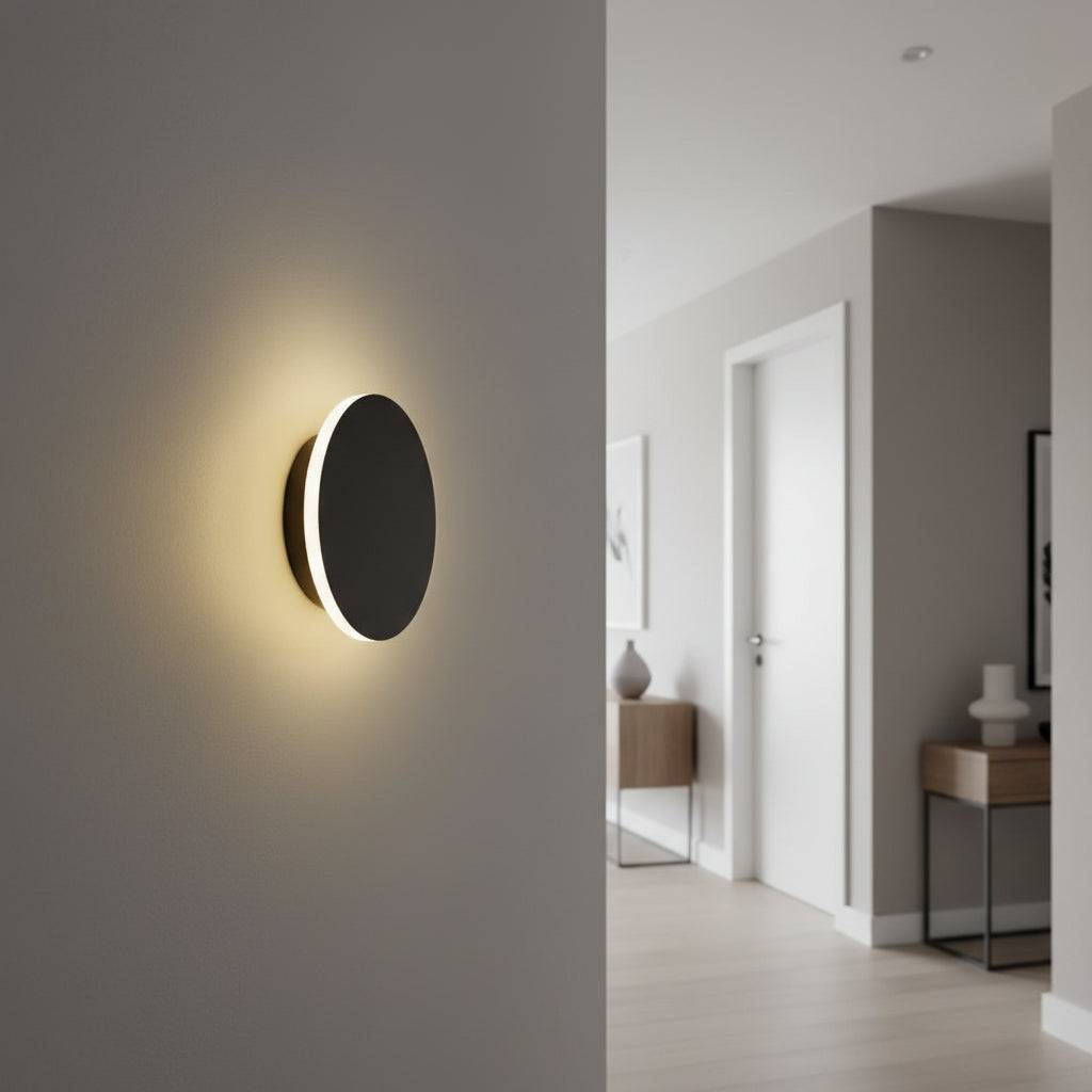 Modern black wall sconce on the wall of a hallway in a modern home