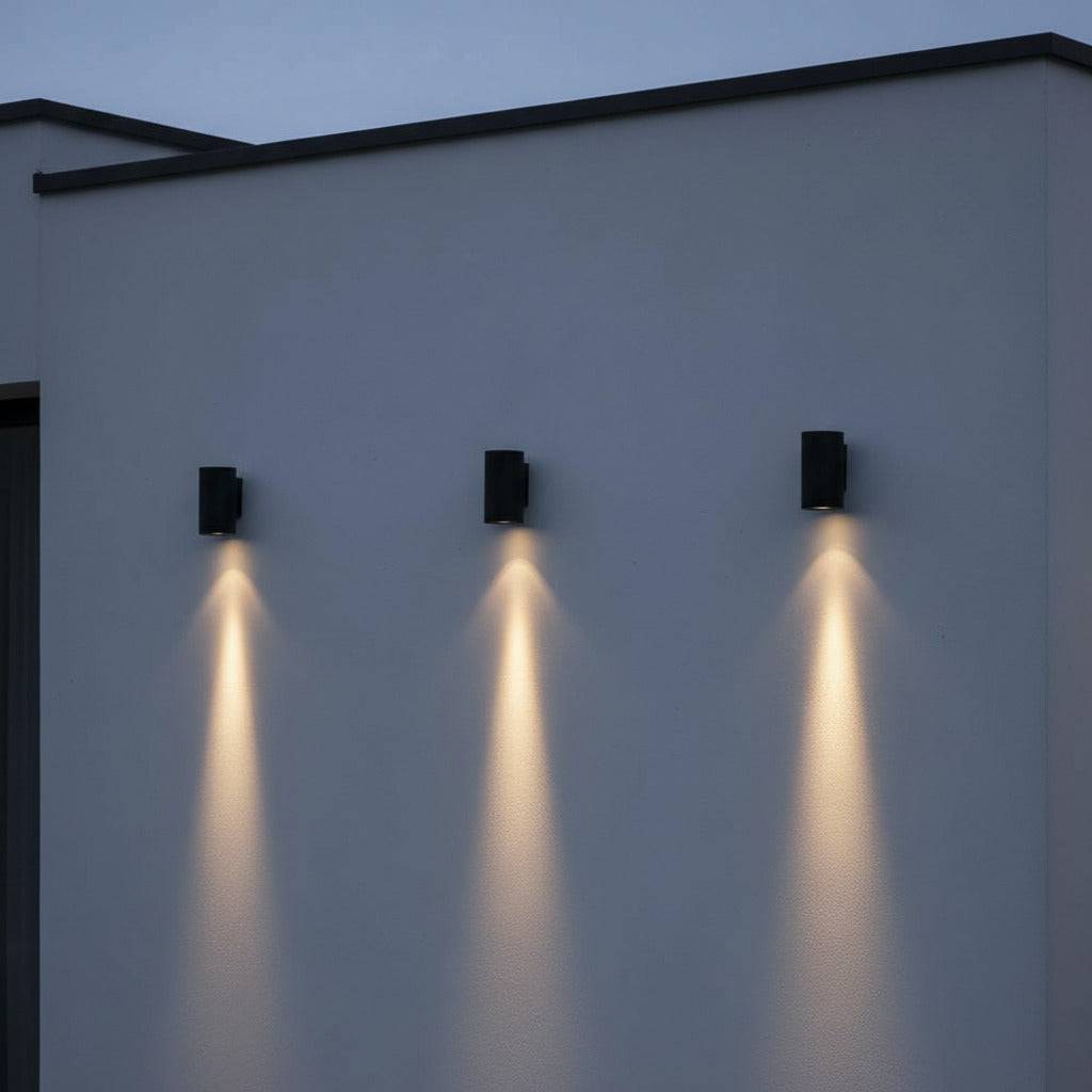 black exterior wall downlight - 3 lights mounted along the wall of a modern building 