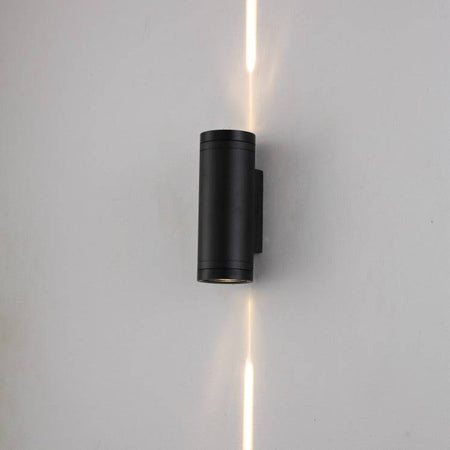 black up & down outside light shown on a white wall 