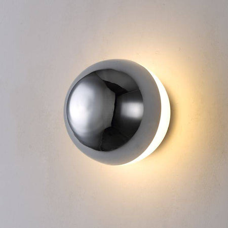 Chrome indoor wall light on a white background